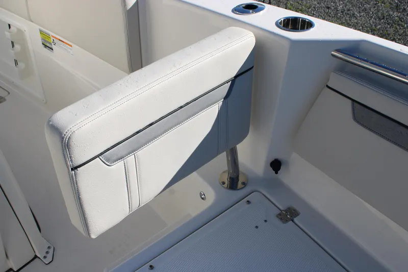 Slide: The Image of 2026 Sailfish 252 CC boat seat with cup holders and sleek design. - 26