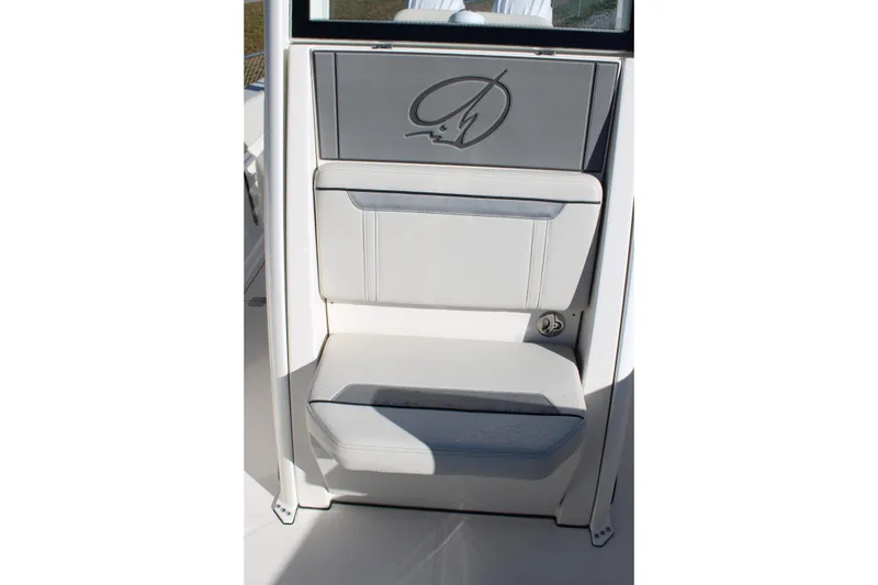 Slide: The Image of 2026 Sailfish 252 CC boat interior with cushioned seating and logo detail. - 27