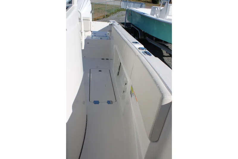 Slide: The Image of 2026 Sailfish 252 CC boat interior with storage compartments and seating. - 29