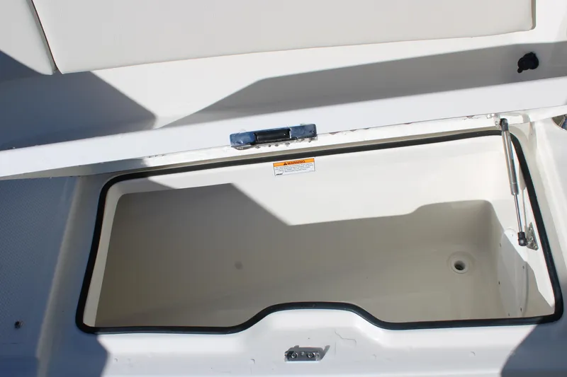 Slide: The Image of Open storage compartment on 2026 Sailfish 252 CC boat, featuring a spacious interior. - 32