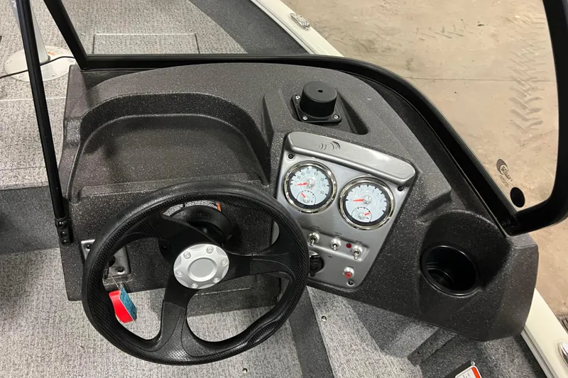 Slide: The Image of 2022 Tracker Pro Guide V-16 WT boat dashboard with steering wheel and gauges. - 21
