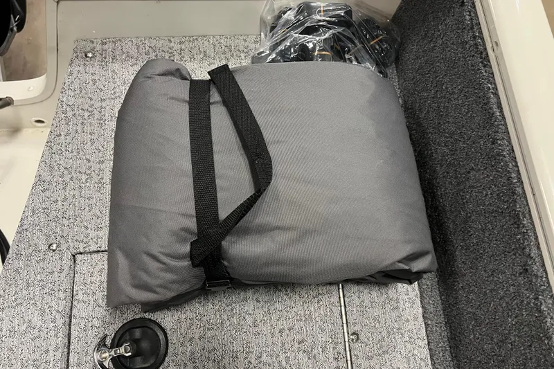 Slide: The Image of Gray cushion on 2022 Tracker Pro Guide V-16 WT boat's carpeted floor. - 26