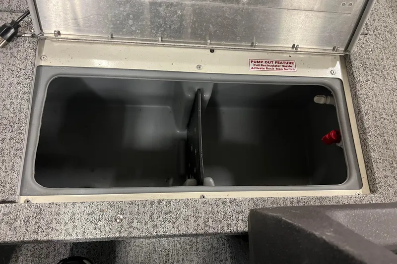 Slide: The Image of 2022 Tracker Pro Guide V-16 WT boat storage compartment with pump-out feature. - 28