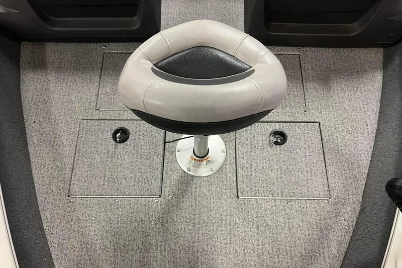 Slide: The Image of 2022 Tracker Pro Guide V-16 WT boat seat on carpeted deck. - 33