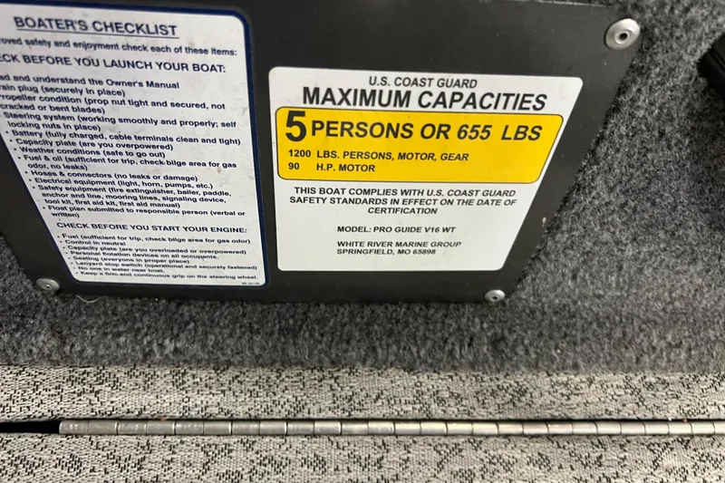 Slide: The Image of 2022 Tracker Pro Guide V-16 WT capacity plate, 5 persons or 655 lbs, safety checklist. - 37