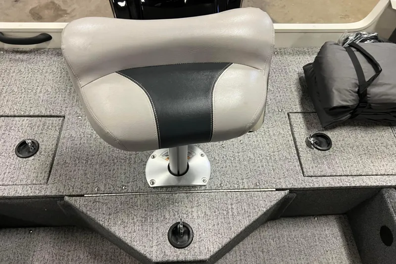 Slide: The Image of 2022 Tracker Pro Guide V-16 WT boat seat on carpeted deck. - 39