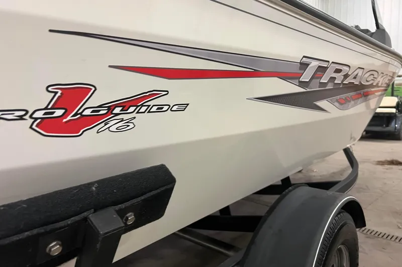 Slide: The Image of 2022 Tracker Pro Guide V-16 WT boat on trailer, side view with logo. - 45