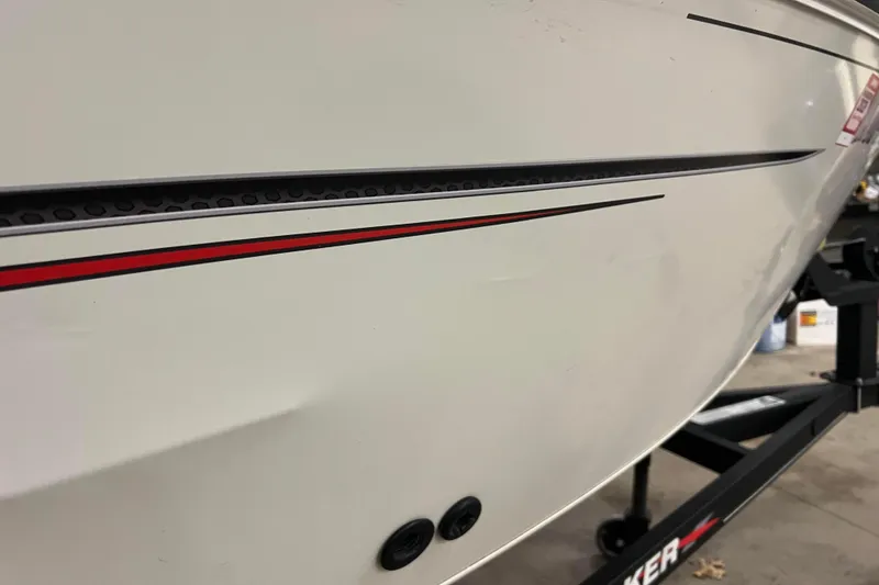 Slide: The Image of 2022 Tracker Pro Guide V-16 WT boat with sleek red and black detailing. - 47