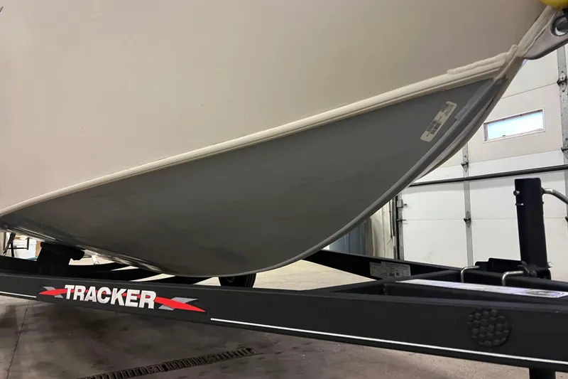 Slide: The Image of 2022 Tracker Pro Guide V-16 WT boat on trailer in garage. - 49