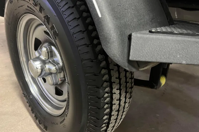 Slide: The Image of Close-up of a 2022 Tracker Pro Guide V-16 WT trailer tire and wheel. - 53
