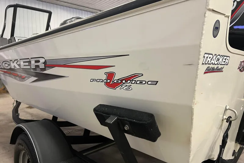Slide: The Image of 2022 Tracker Pro Guide V-16 WT boat on trailer in indoor setting. - 54