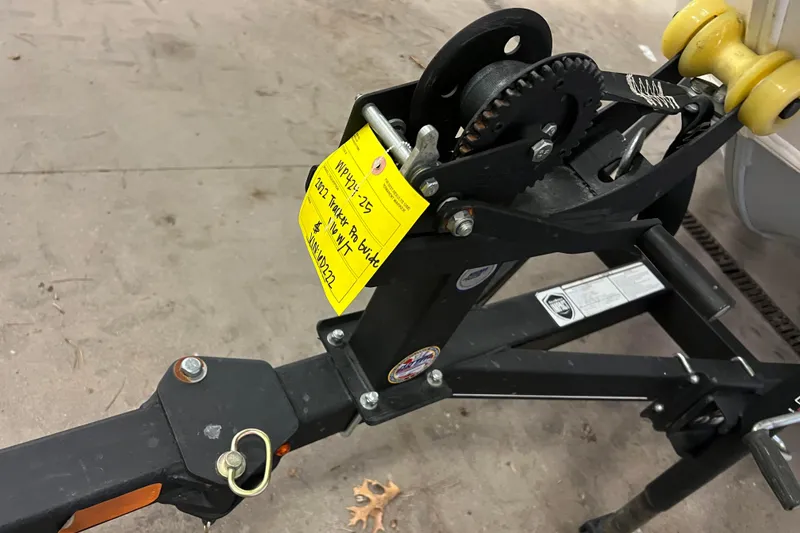 Slide: The Image of Trailer hitch of 2022 Tracker Pro Guide V-16 WT with yellow tag attached. - 7