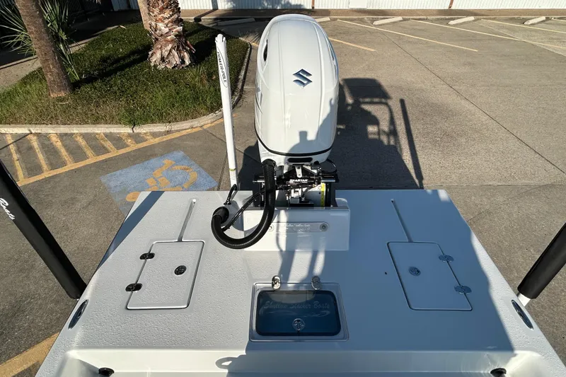 Slide: The Image of 2026 Shallow Stalker CAT 211 PRO boat with Suzuki outboard motor in parking lot. - 11