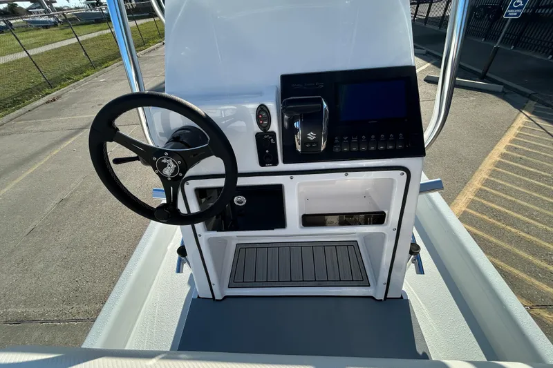 Slide: The Image of 2026 Shallow Stalker CAT 211 PRO boat console with steering wheel and control panel. - 12
