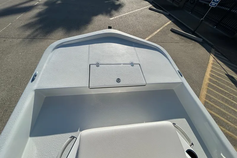 Slide: The Image of 2026 Shallow Stalker CAT 211 PRO boat deck, featuring sleek design and storage compartment. - 16