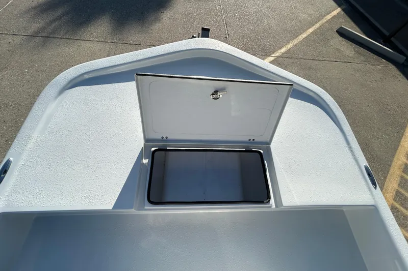 Slide: The Image of 2026 Shallow Stalker CAT 211 PRO boat deck with open storage compartment. - 17