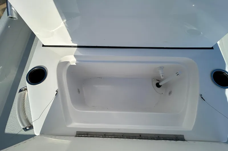Slide: The Image of Open storage compartment in 2026 Shallow Stalker CAT 211 PRO boat. - 19