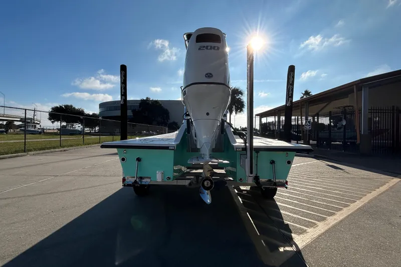 Slide: The Image of 2026 Shallow Stalker CAT 211 PRO boat with powerful engine, parked under sunny sky. - 6