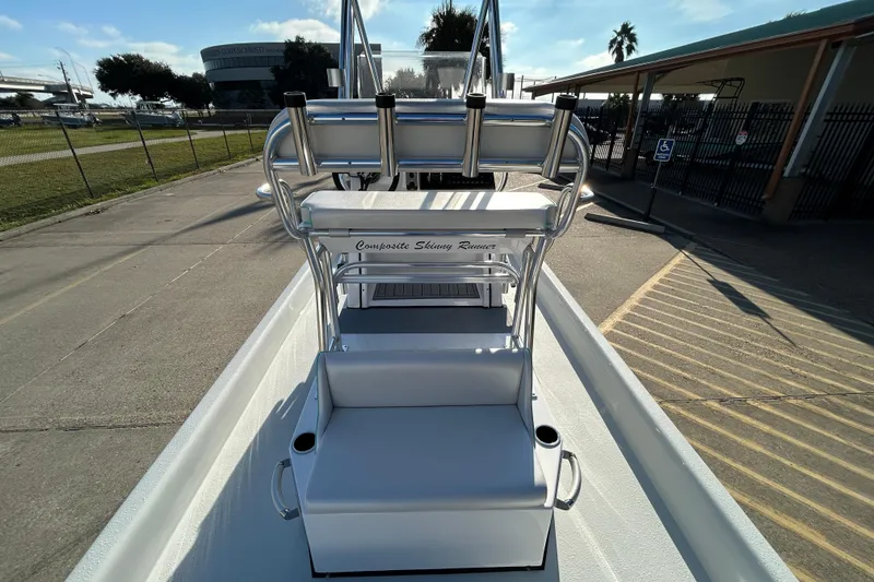 Slide: The Image of 2026 Shallow Stalker CAT 211 PRO boat, sleek design, outdoor setting, sunny day. - 9