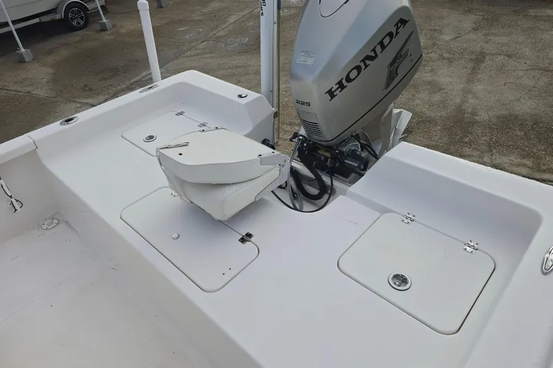 Slide: The Image of 2011 Tidewater 2400 Bay Max boat with Honda 225 outboard motor. - 14