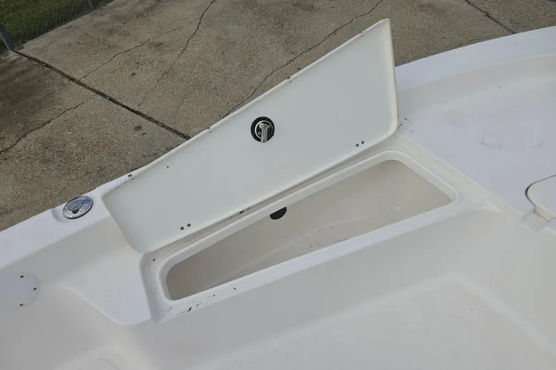 Slide: The Image of Open storage compartment on 2011 Tidewater 2400 Bay Max boat. - 18