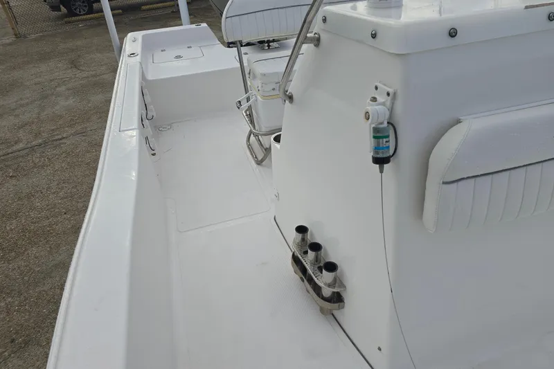 Slide: The Image of 2011 Tidewater 2400 Bay Max boat interior with seating and rod holders. - 19