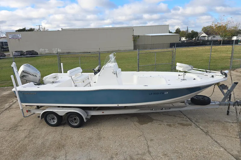 Slide: The Image of 2011 Tidewater 2400 Bay Max boat on trailer with Honda outboard motor. - 3