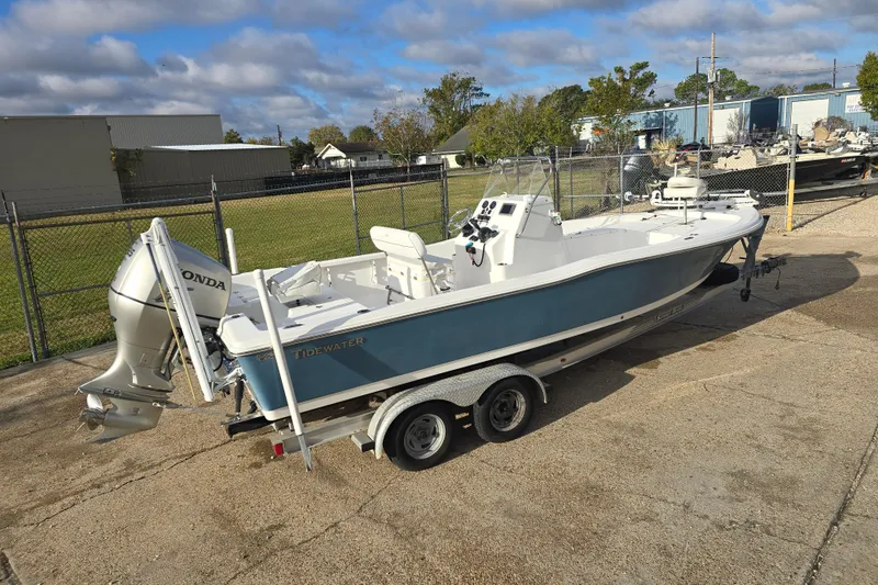 Slide: The Image of 2011 Tidewater 2400 Bay Max boat on trailer with Honda outboard motor. - 4