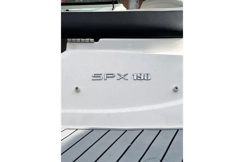 Slide: The Image of 2021 Sea Ray SPX 190 Outboard boat emblem on white surface. - 13