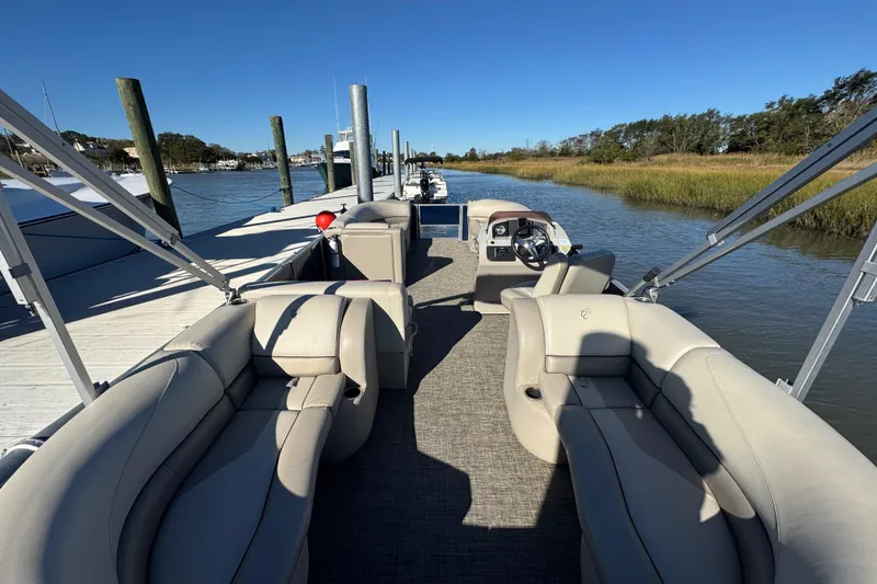 Slide: The Image of 2023 Cypress Cay Seabreeze 232 pontoon boat docked on a sunny day. - 4