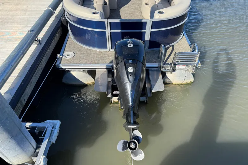 Slide: The Image of 2023 Cypress Cay Seabreeze 232 pontoon boat with outboard motor at dock. - 6