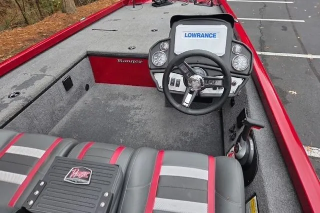 Slide: The Image of 2023 Ranger RT188C boat interior with steering wheel and Lowrance display. - 1
