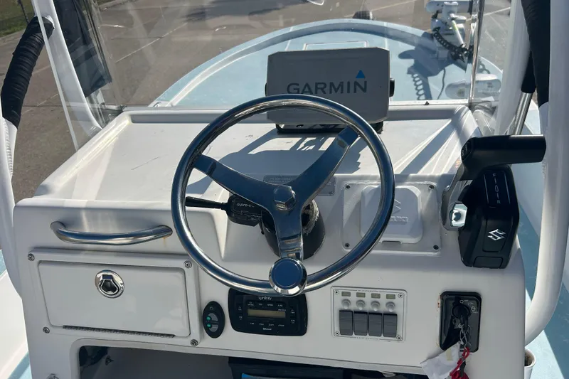 Slide: The Image of 2016 Shallow Sport 21 Sport boat dashboard with Garmin navigation system. - 14
