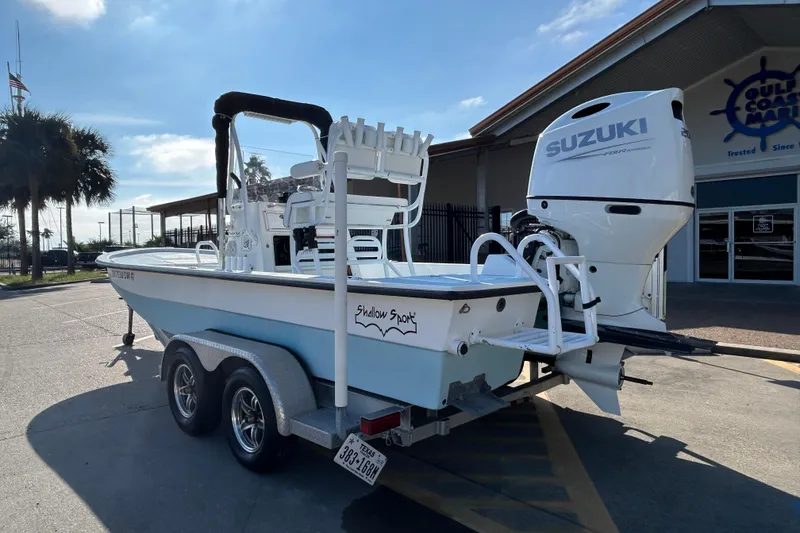 Slide: The Image of 2016 Shallow Sport 21 Sport boat with Suzuki engine on a trailer. - 8