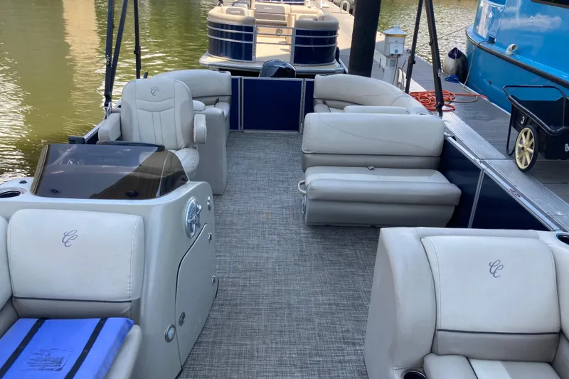 Slide: The Image of 2023 Cypress Cay Seabreeze 232 pontoon boat with luxurious seating and modern design. - 4