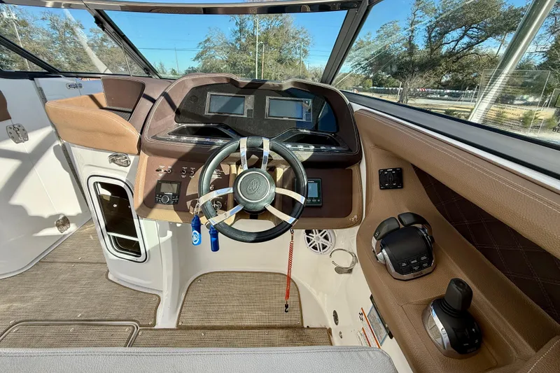 Slide: The Image of 2018 Cobalt R35 boat cockpit with modern steering and control panel. - 14