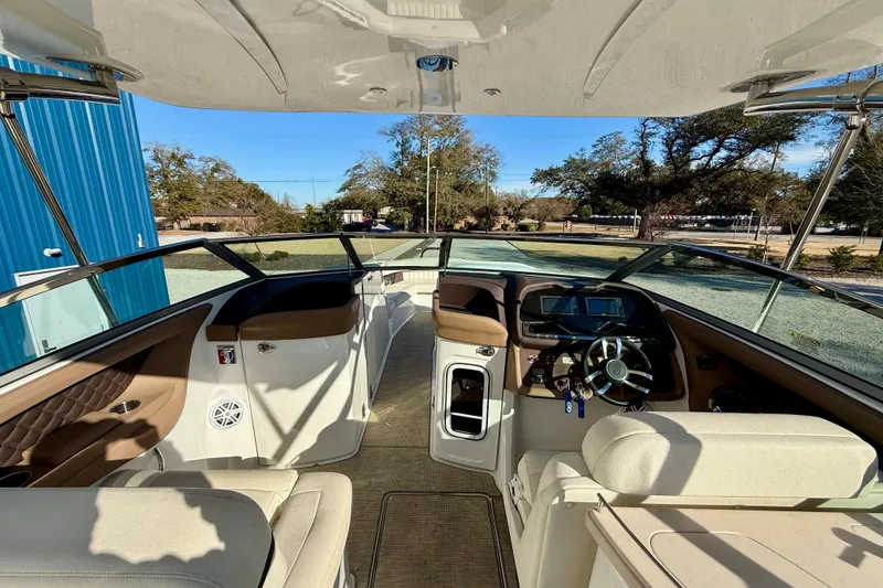 Slide: The Image of Interior view of a 2018 Cobalt R35 boat, featuring a modern helm and seating. - 15