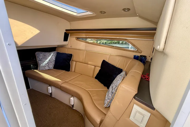 Slide: The Image of Luxurious interior of 2018 Cobalt R35 boat with tan leather seating and decorative pillows. - 18