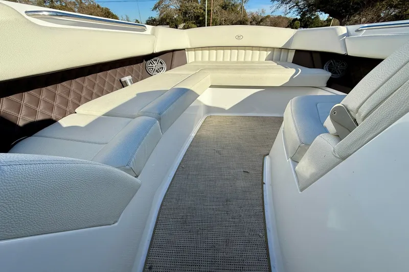 Slide: The Image of Interior of 2018 Cobalt R35 boat with white leather seating and carpeted floor. - 20