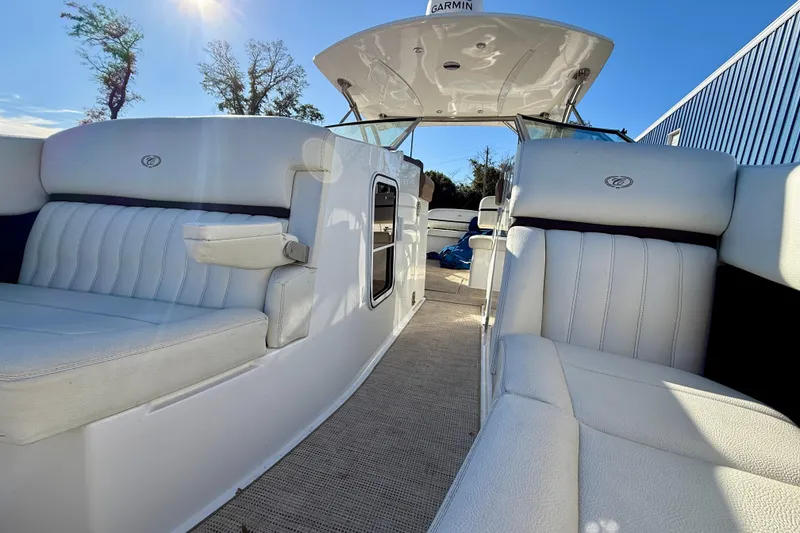 Slide: The Image of Luxurious interior of 2018 Cobalt R35 boat with white seating and sunny sky. - 21