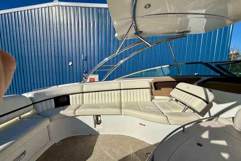 Slide: The Image of 2018 Cobalt R35 boat interior with white leather seating and blue metal siding. - 6