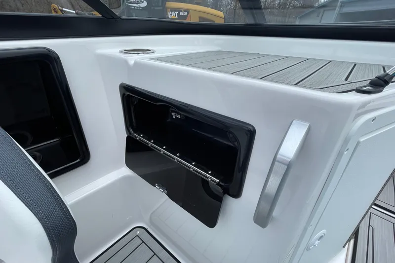 Slide: The Image of 2025 Yamaha Boats 195S interior with open storage compartment and sleek design. - 11