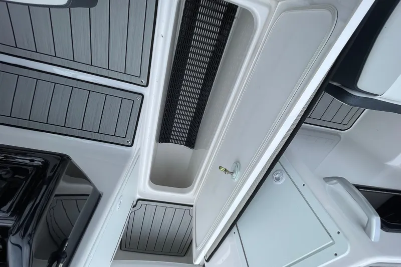 Slide: The Image of Interior view of 2025 Yamaha Boats 195S, showcasing sleek design and storage compartments. - 18