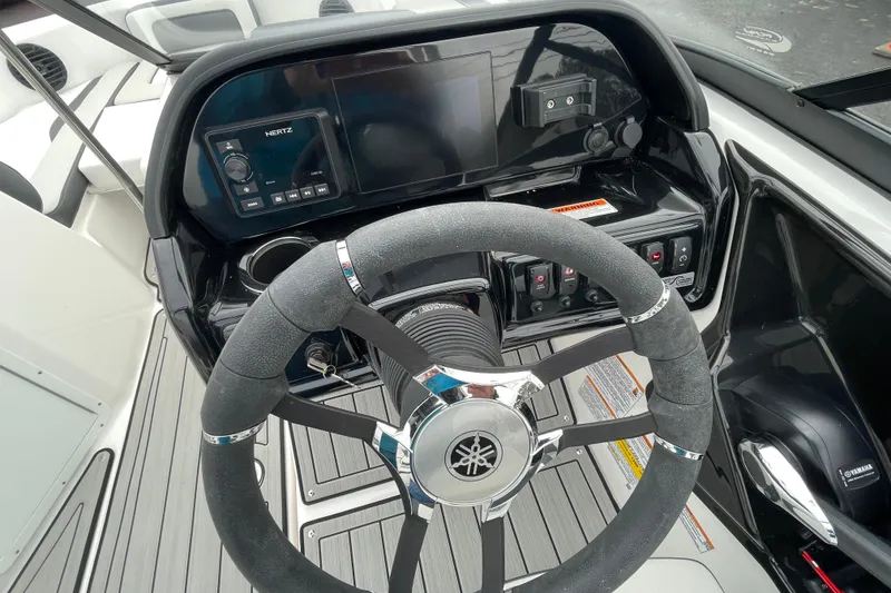 Slide: The Image of 2025 Yamaha Boats 195S dashboard with steering wheel and control panel. - 2