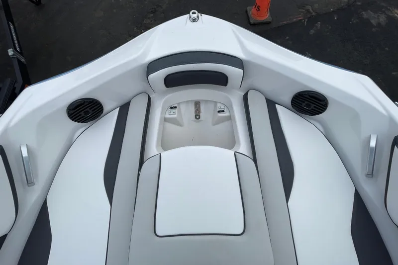 Slide: The Image of 2025 Yamaha Boats 195S interior with white seating and built-in speakers. - 5