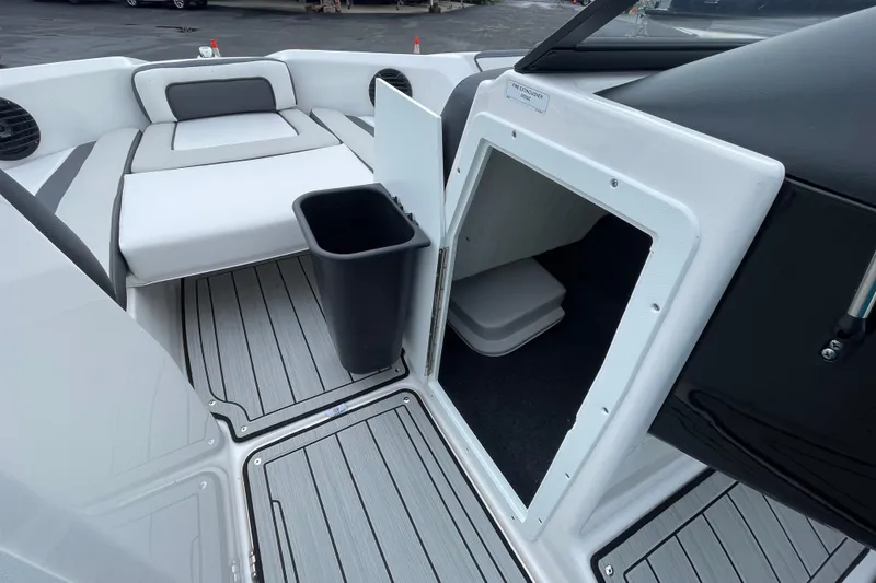 Slide: The Image of 2025 Yamaha Boats 195S interior with storage compartment and seating area. - 9