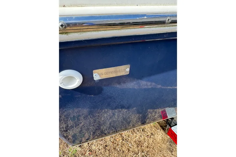 Slide: The Image of 2022 Hurricane FunDeck 1960 RE boat with visible hull identification number. - 10