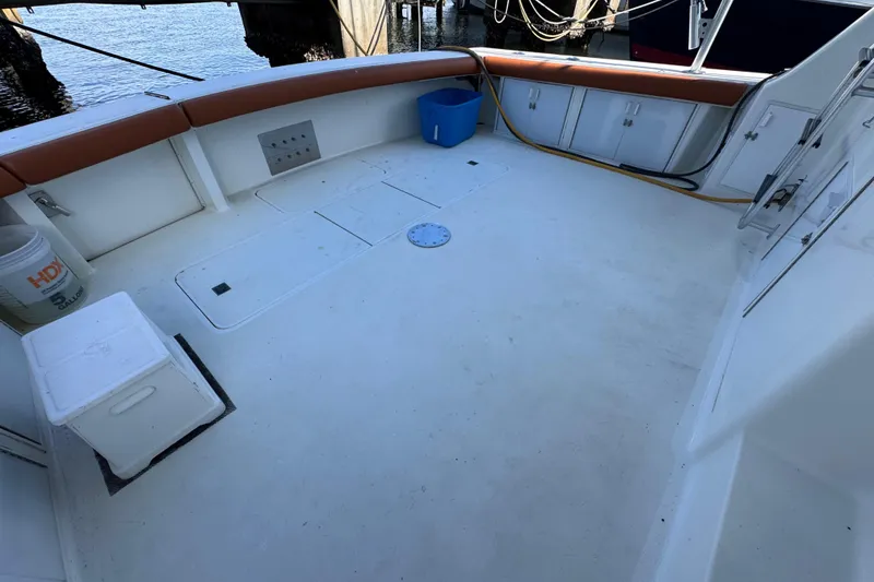 Slide: The Image of Spacious deck of 1995 Viking 58 Convertible yacht with seating and storage. - 12