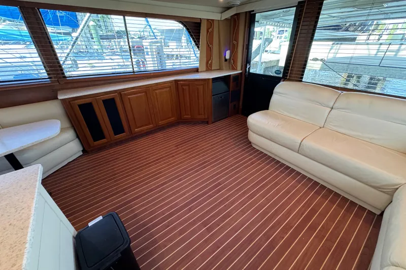 Slide: The Image of Interior of 1995 Viking 58 Convertible yacht with leather seating and wood cabinetry. - 21