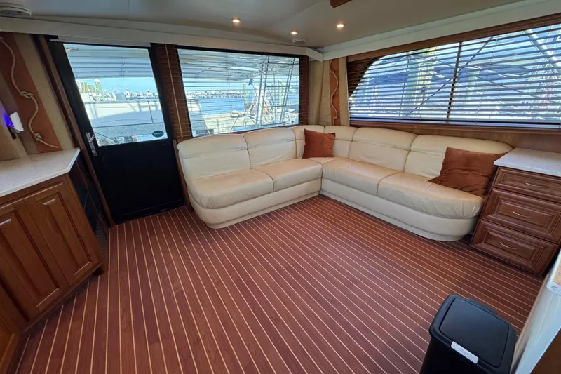 Slide: The Image of Luxurious interior of 1995 Viking 58 Convertible yacht with leather seating and wood accents. - 22